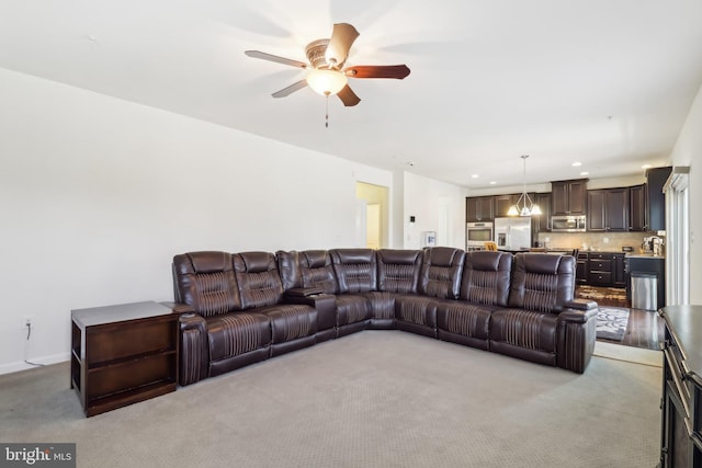 living room featuring ceiling fan and light carpet