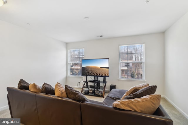 living room with light carpet and a wealth of natural light