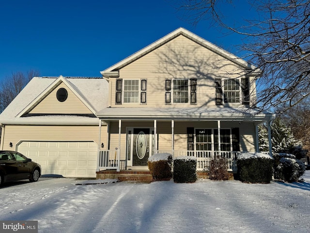 view of front of home with a porch, driveway, and an attached garage