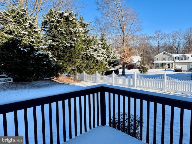 view of snow covered deck