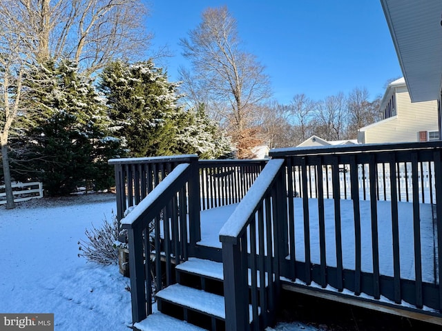 view of snow covered deck