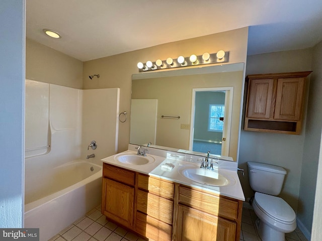 full bathroom featuring tile patterned floors,  shower combination, toilet, and vanity