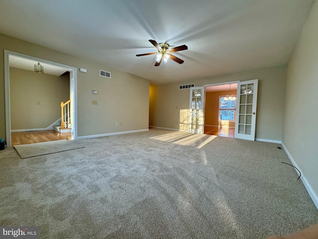 unfurnished room with ceiling fan and carpet flooring