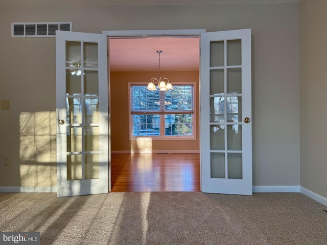 interior space featuring a chandelier