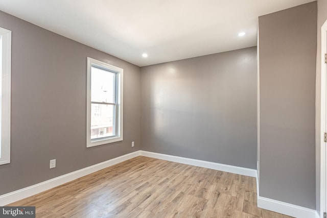 spare room featuring light hardwood / wood-style flooring