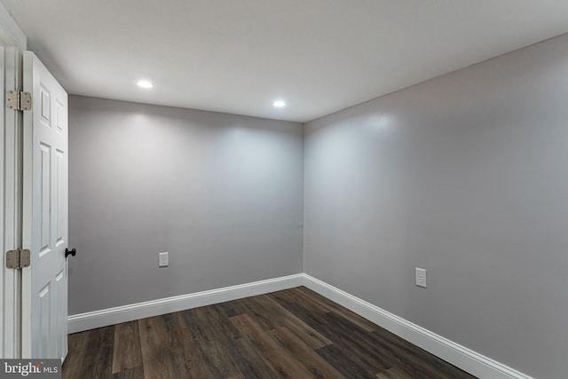 spare room featuring dark hardwood / wood-style flooring