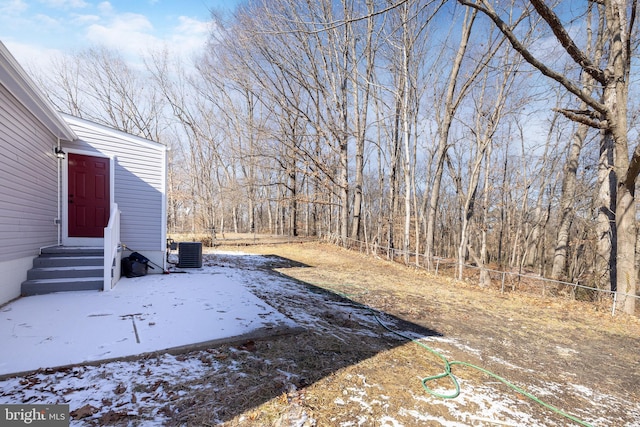 yard layered in snow with cooling unit