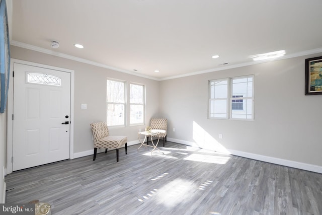 unfurnished room featuring ornamental molding and wood-type flooring