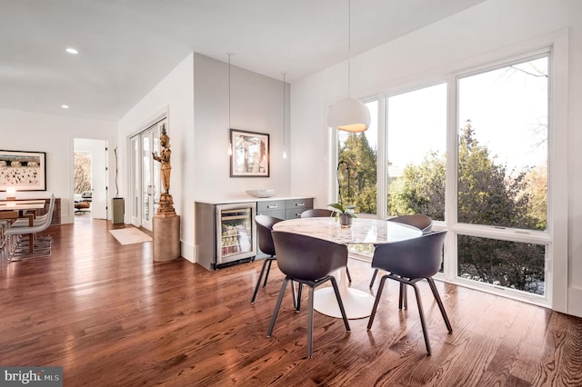 dining room with dark wood-type flooring and wine cooler