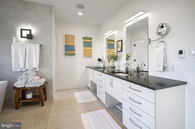 bathroom with vanity and tile patterned flooring