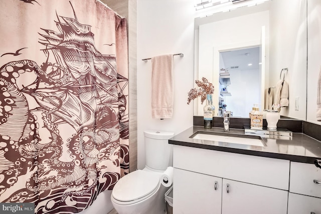 bathroom with vanity and toilet