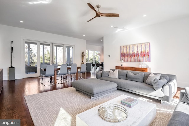 living room featuring dark hardwood / wood-style floors, ceiling fan, and french doors