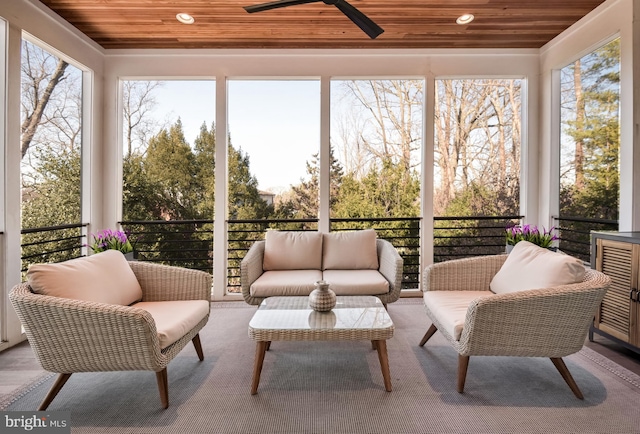 sunroom / solarium with wood ceiling and ceiling fan