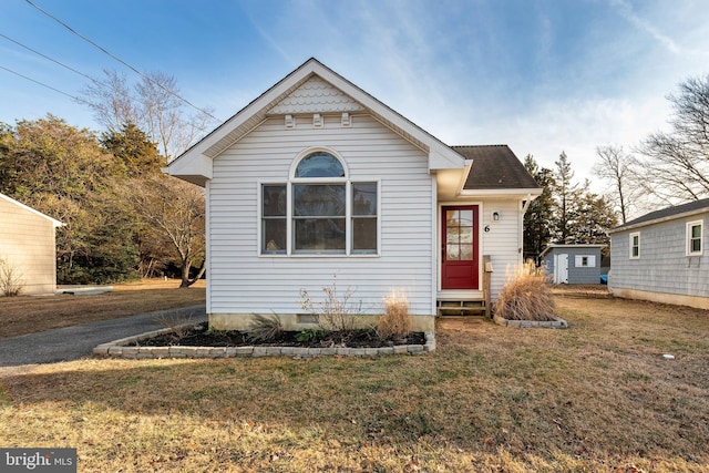 bungalow with a front yard