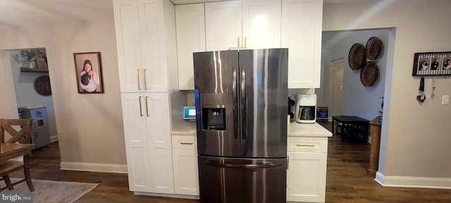 kitchen featuring white cabinetry, stainless steel fridge with ice dispenser, and dark hardwood / wood-style flooring