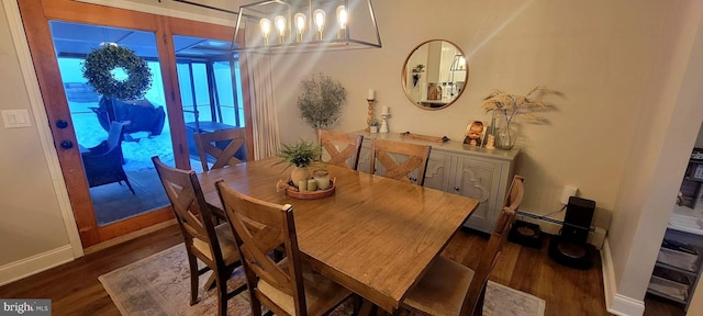 dining area with dark wood-type flooring