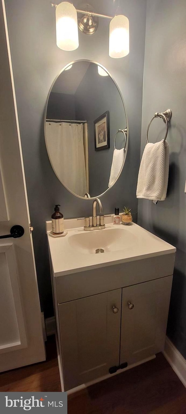 bathroom featuring vanity and hardwood / wood-style flooring