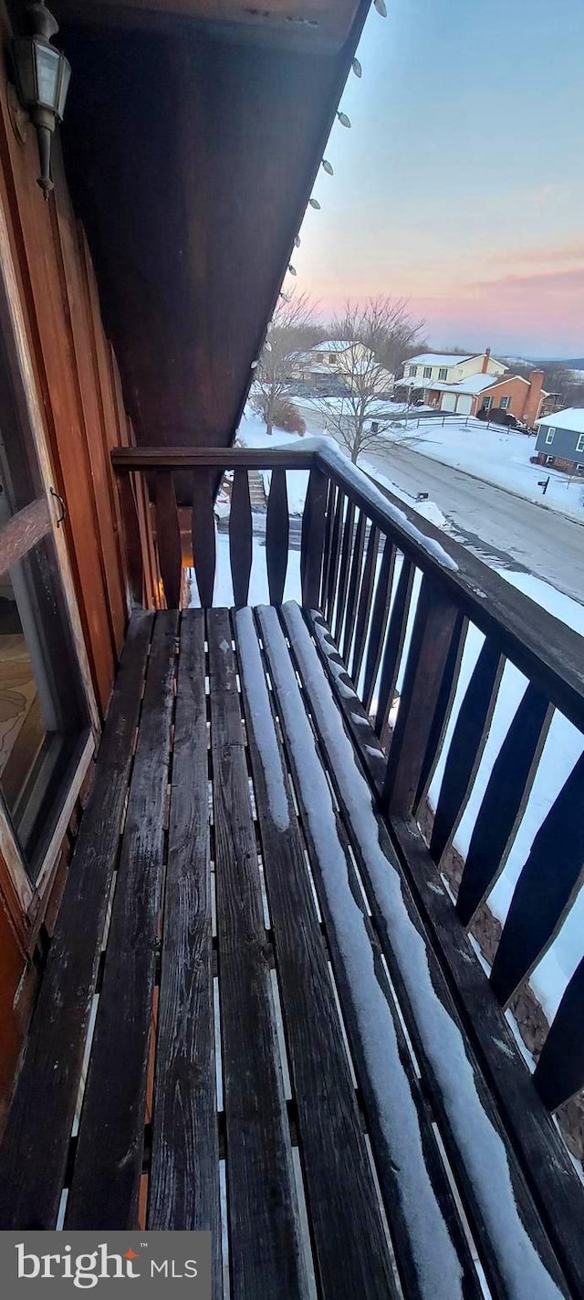 view of balcony at dusk