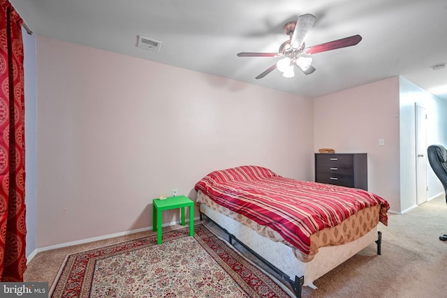 bedroom featuring light carpet and ceiling fan