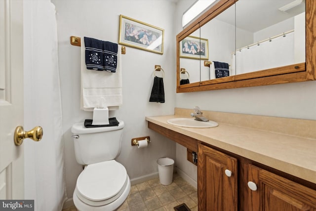 bathroom featuring toilet and sink