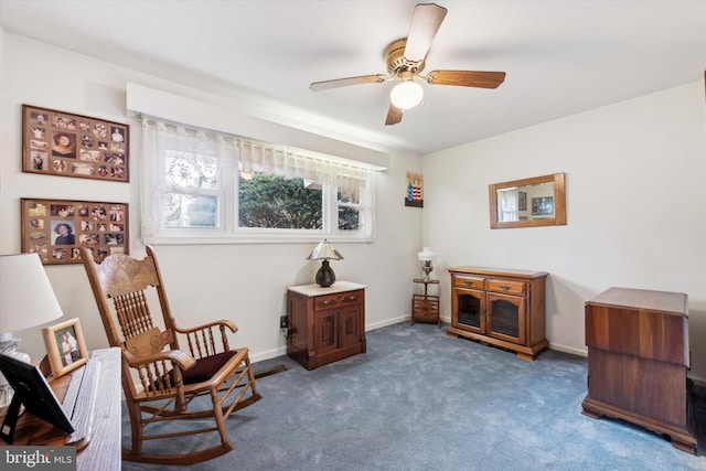 sitting room featuring carpet floors and ceiling fan