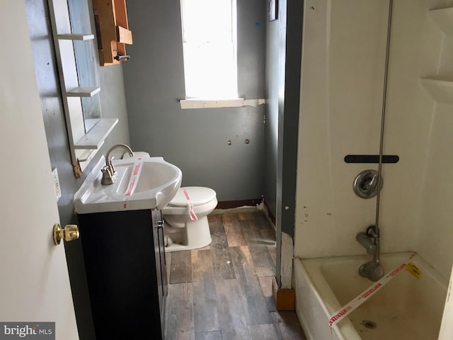 bathroom featuring vanity, toilet, and hardwood / wood-style floors