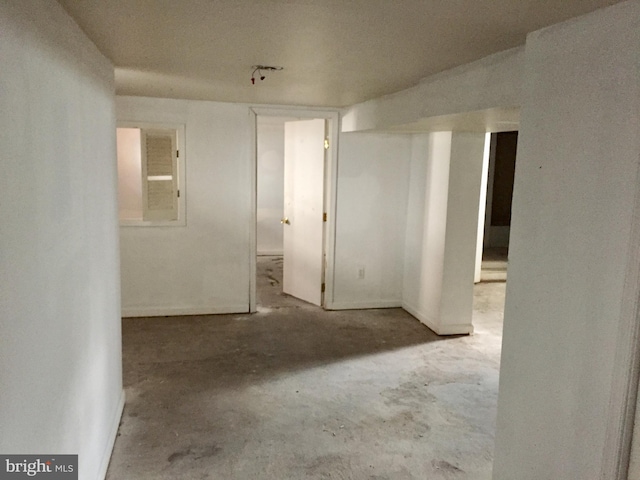 empty room with concrete flooring