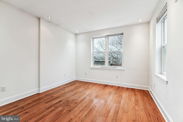 spare room with light hardwood / wood-style floors