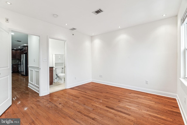 unfurnished room featuring wood-type flooring