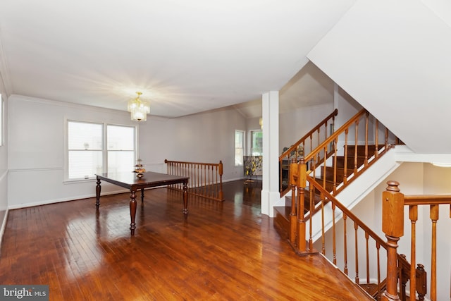 playroom featuring hardwood / wood-style floors and a notable chandelier