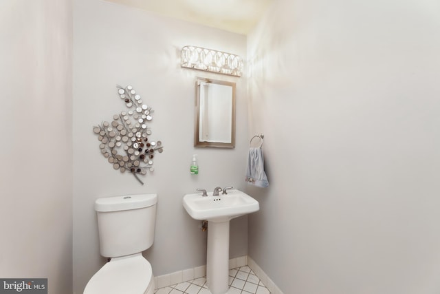 bathroom featuring tile patterned floors and toilet