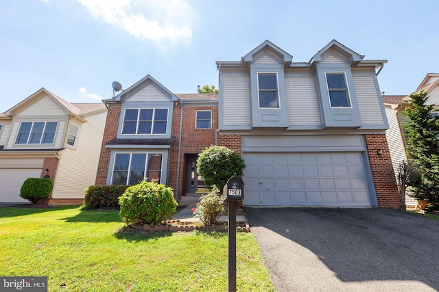 view of front of property with a garage and a front yard