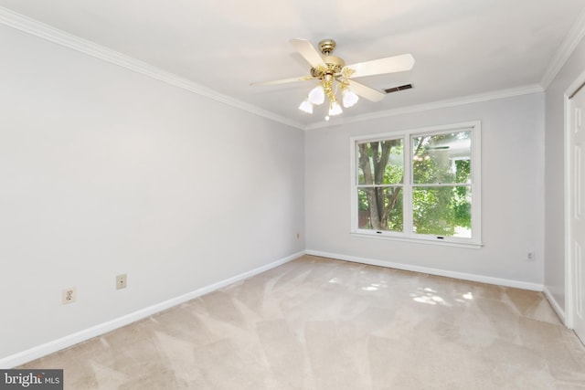 unfurnished room featuring ceiling fan, ornamental molding, and light carpet