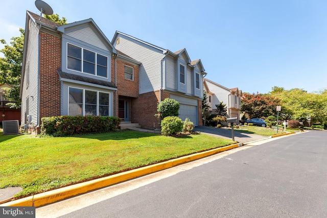 view of front of house with cooling unit, a garage, and a front lawn