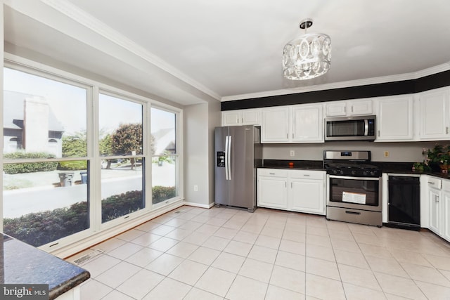 kitchen with light tile patterned flooring, appliances with stainless steel finishes, pendant lighting, white cabinets, and ornamental molding