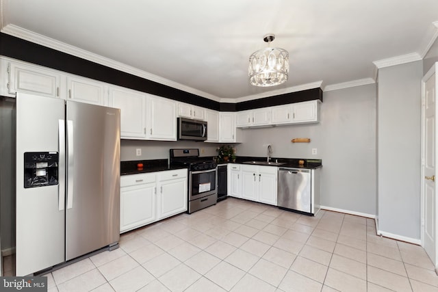 kitchen featuring sink, white cabinetry, crown molding, decorative light fixtures, and stainless steel appliances