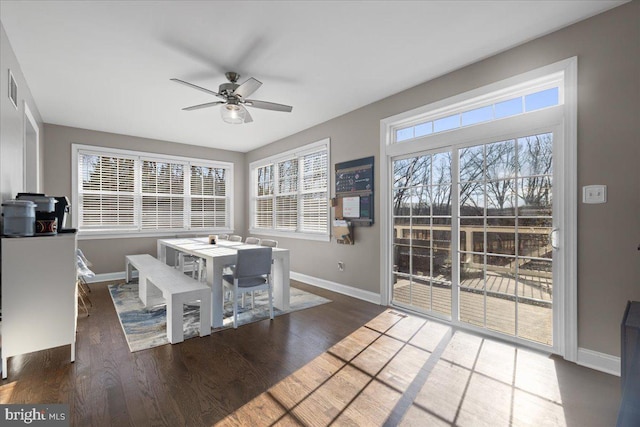 dining area featuring dark hardwood / wood-style floors and ceiling fan