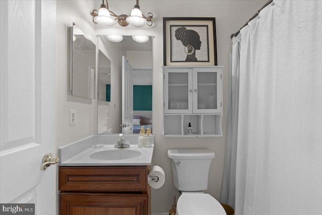 bathroom with toilet and vanity