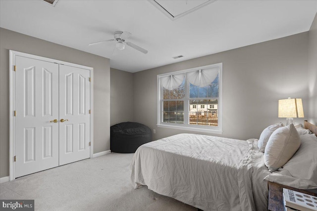 bedroom featuring ceiling fan, carpet flooring, and a closet