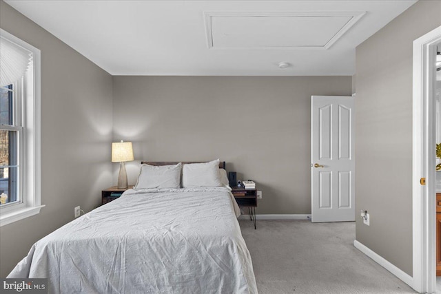 bedroom featuring light carpet