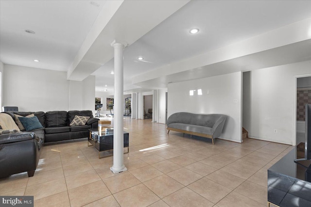 tiled living room featuring ornate columns