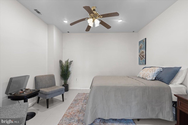 tiled bedroom with ceiling fan