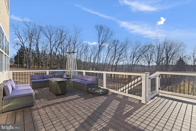 wooden terrace featuring outdoor lounge area