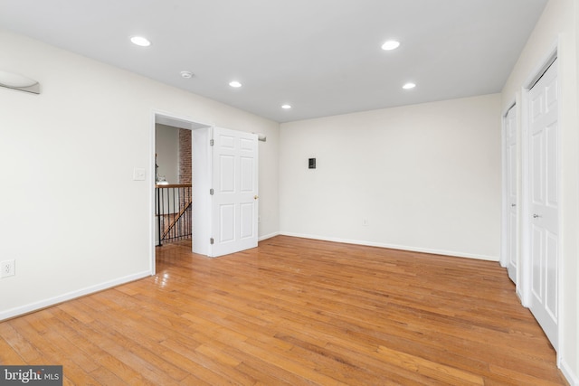 interior space with recessed lighting, light wood-style flooring, and baseboards