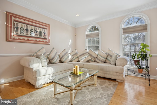 living room with hardwood / wood-style flooring and ornamental molding