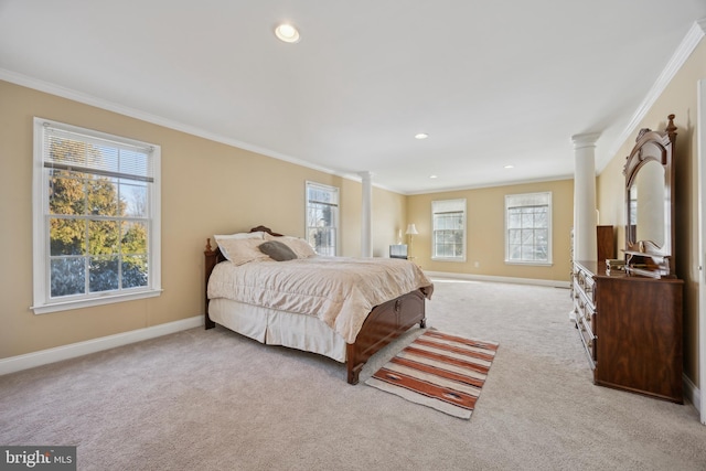 bedroom featuring light carpet, ornamental molding, and decorative columns