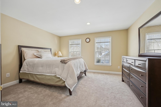 bedroom with light colored carpet