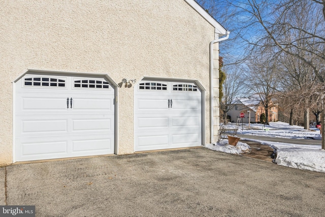 view of snow covered garage