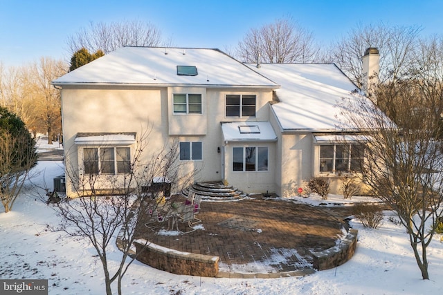 view of snow covered house