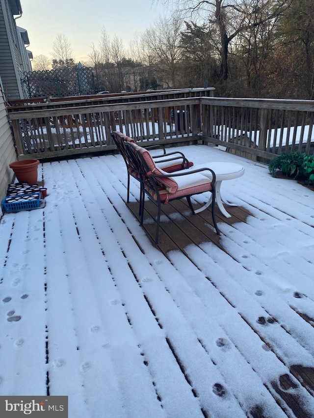 view of snow covered deck